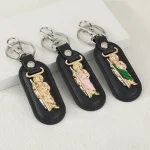 Catholic Leather Keychain with Metal Pendant Saint Christopher Cartoon Doll Keychain Metal Jewelry Pendant and Car Bag Pendant